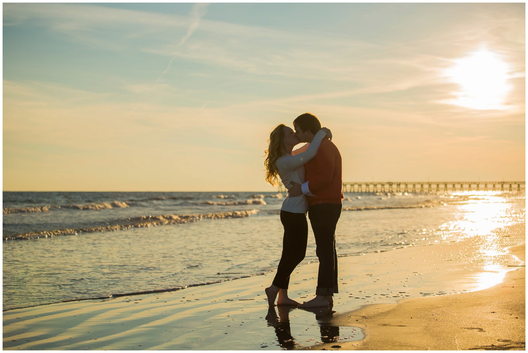 Kiss at the sunset on the shores of Atlantic Ocean