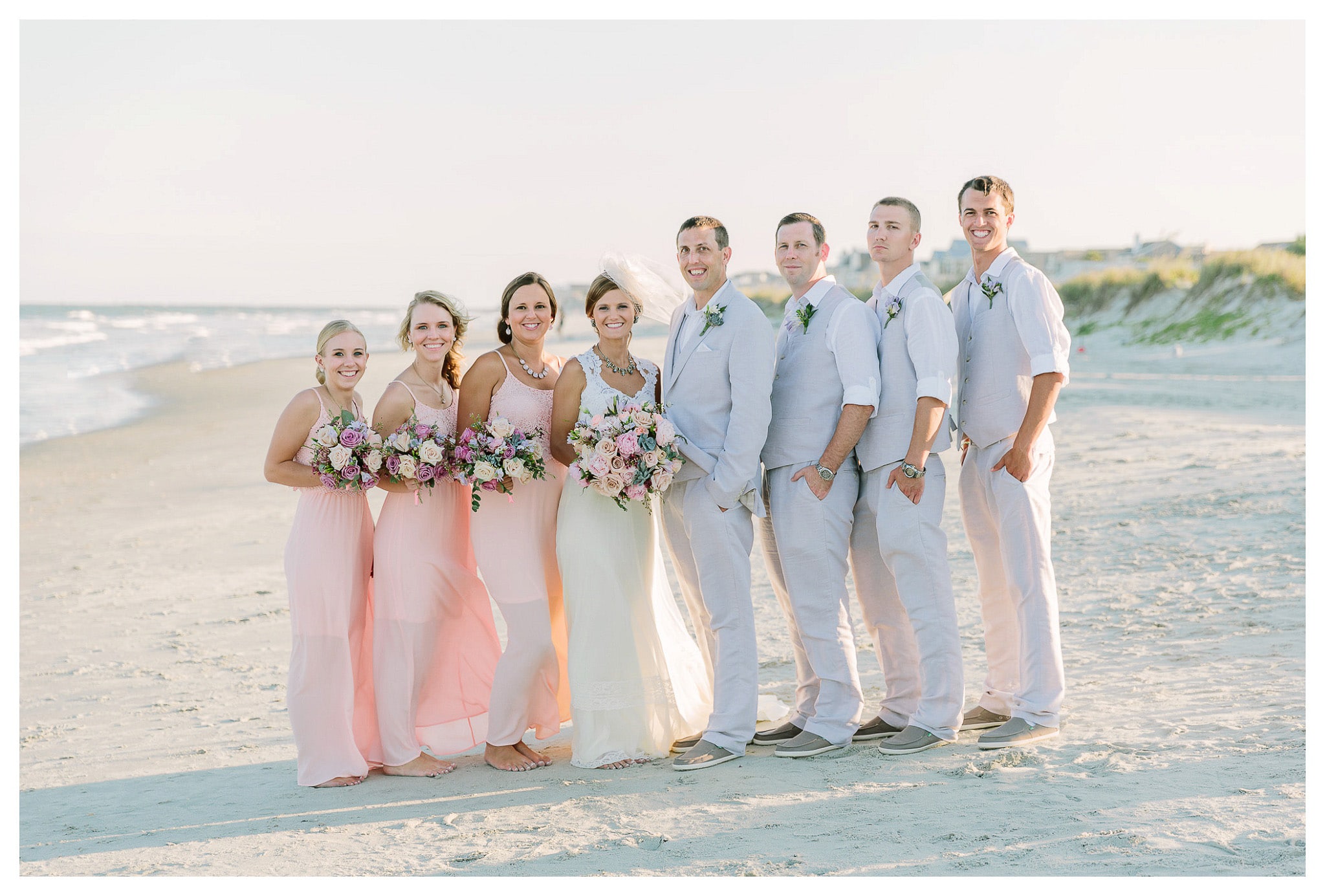 The Wedding Party on the Sand Bride and Maids, Groom and Groomsmen - Venue - Beach House Gulf Stream Breeze, Beach Realty Catering and Cake - Buttercream Cakes and Catering, LLC Flowers - Callas Florist Event Rentals - Event Works DJ - Scott Shaw