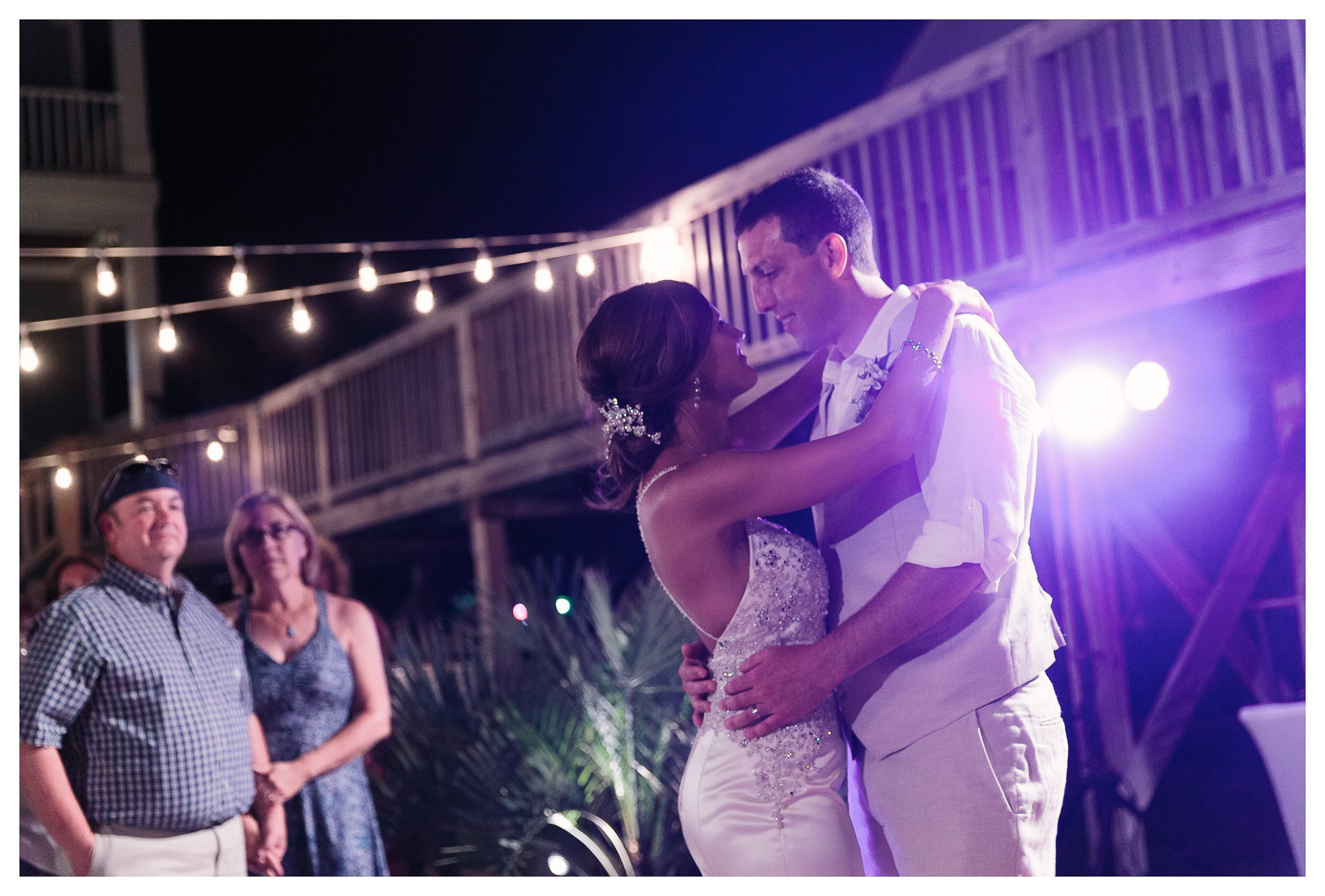 Bride and Groom Dancing the first dance together - Venue - Beach House Gulf Stream Breeze, Beach Realty Catering and Cake - Buttercream Cakes and Catering, LLC Flowers - Callas Florist Event Rentals - Event Works DJ - Scott Shaw