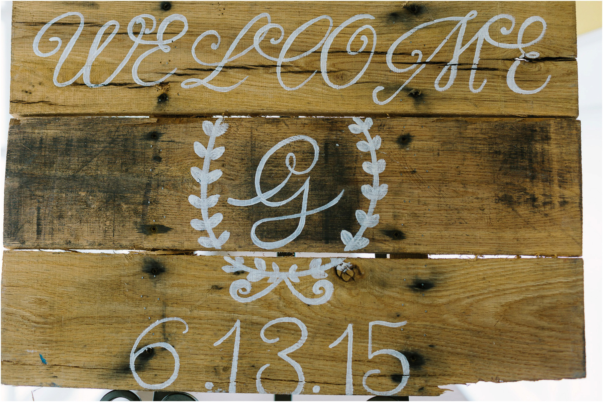Handmade wedding date wooden sign welcoming guests