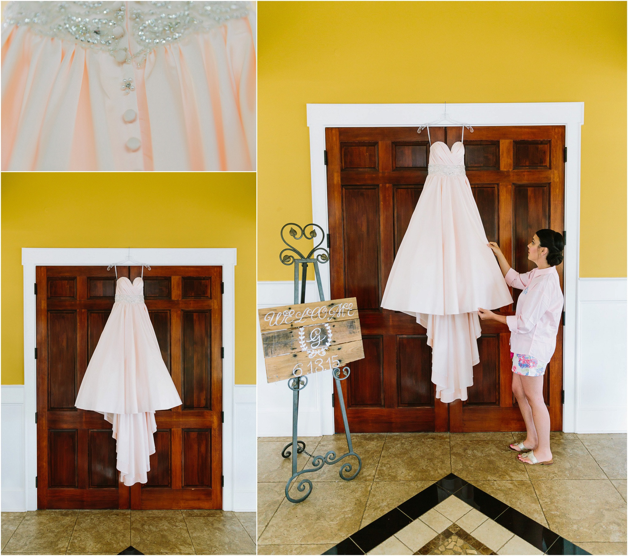 Beautiful pink wedding dress hung against a sturdy wooden double door
