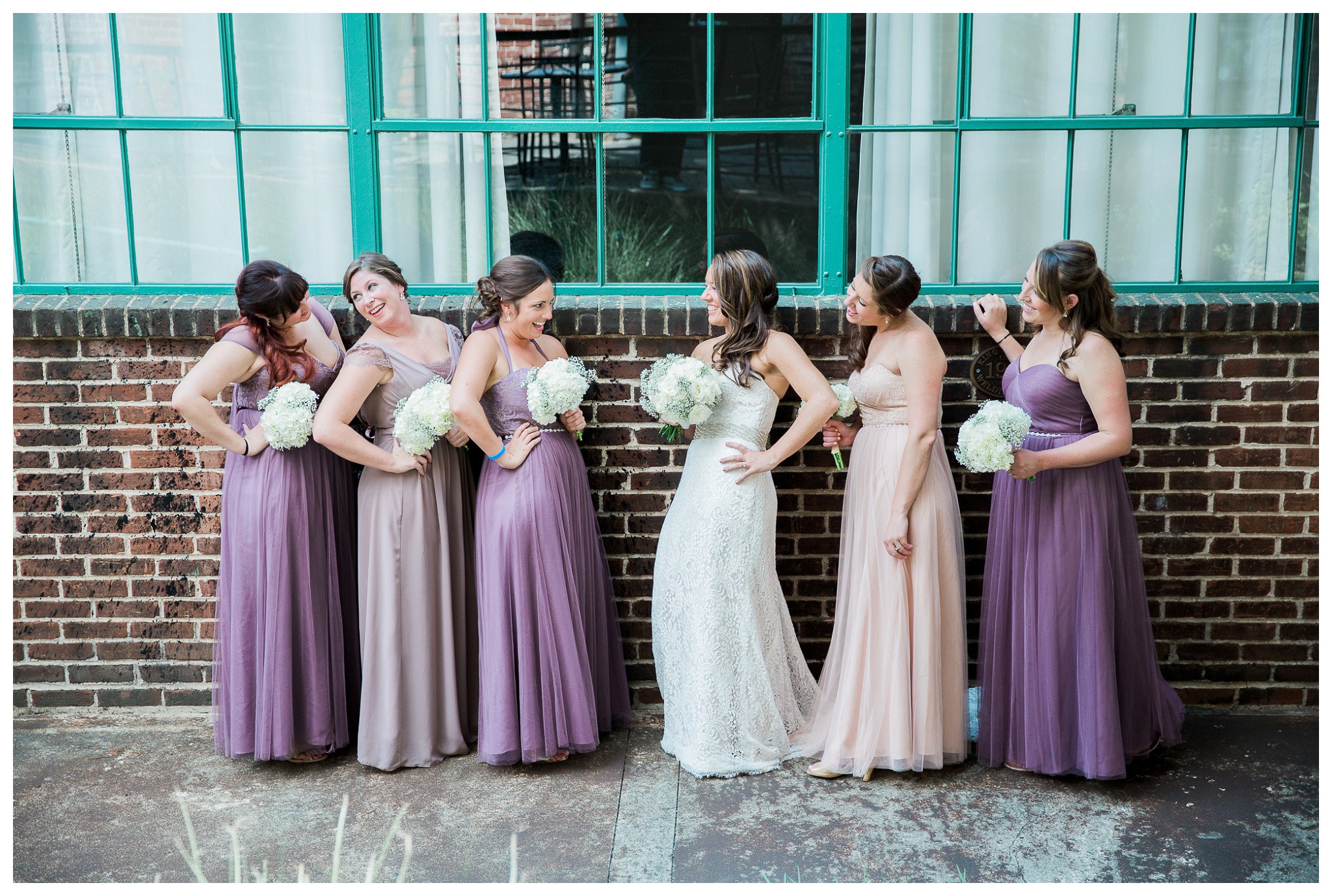 Saucy Ladies, The Bridesmaids fun poses with the bride, Venue and Catering – King plow Event Gallery and Bold American Events Decor and flowers – Stylish Stems Music and Band – Seven Sharp Nine Transportation – Georgia Trolley Photographer One Life Photography
