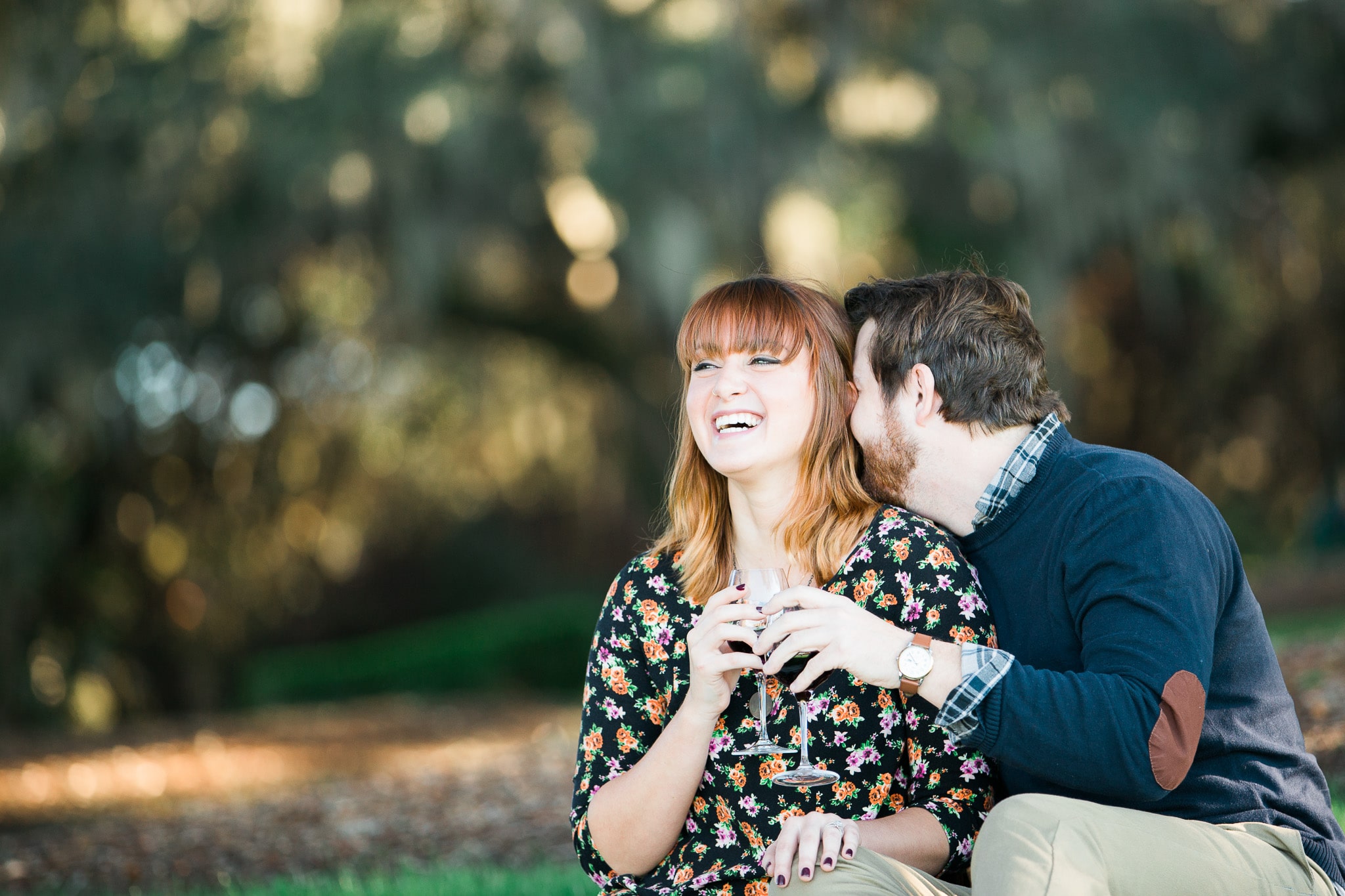Brian whispering a joke in her ear and Kelsey laughing, Caledonia Golf and Fish Club, Myrtle Beach Engagement Session 13, www.onelifephoto.net