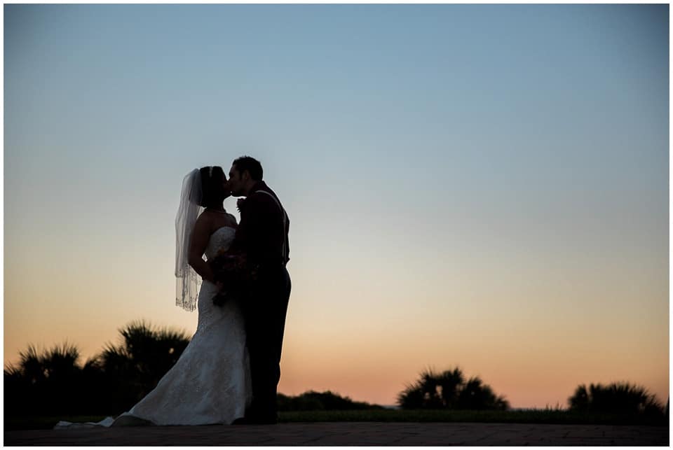 True Love's Kiss - The couple kiss at sunset - Grande Dunes Ocean Club - Myrtle Beach wedding-66.JPG