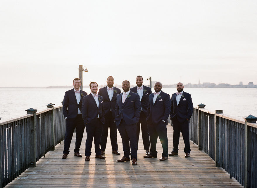 groom and his groomsmen on the pier