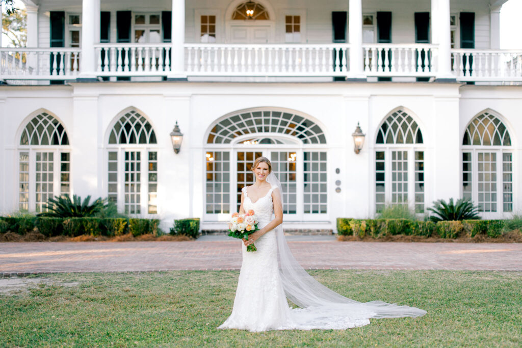 bride on her wedding day in front of the main house