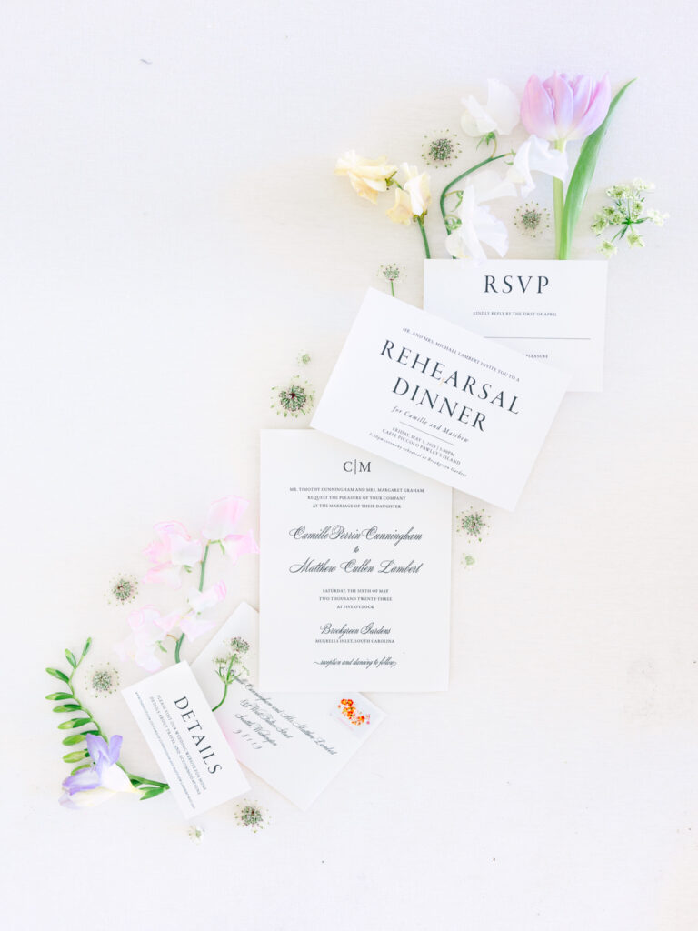 Flat lay invitations and details