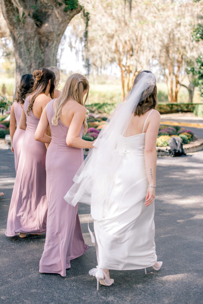 Bride and her bridesmaids walking
